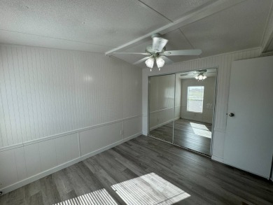 Time to buy is now! This beautiful, totally renovated 2/1.5 bath on Lake Henry Golf Club in Florida - for sale on GolfHomes.com, golf home, golf lot