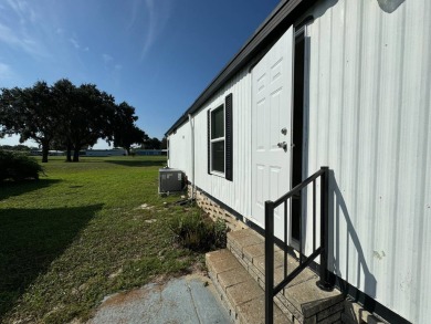 Time to buy is now! This beautiful, totally renovated 2/1.5 bath on Lake Henry Golf Club in Florida - for sale on GolfHomes.com, golf home, golf lot