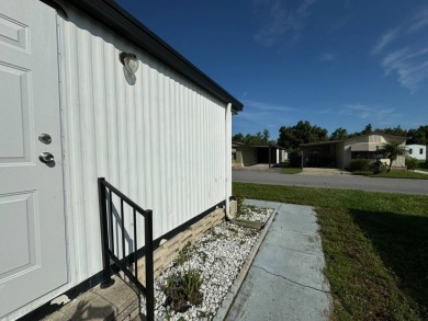 Time to buy is now! This beautiful, totally renovated 2/1.5 bath on Lake Henry Golf Club in Florida - for sale on GolfHomes.com, golf home, golf lot