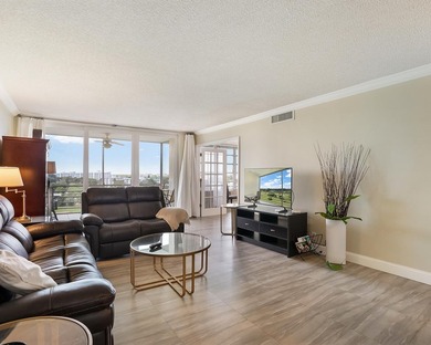 Beautifully remodeled 2BR/2BA top-floor condo in all-age Palm on  in Florida - for sale on GolfHomes.com, golf home, golf lot