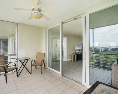 Beautifully remodeled 2BR/2BA top-floor condo in all-age Palm on  in Florida - for sale on GolfHomes.com, golf home, golf lot