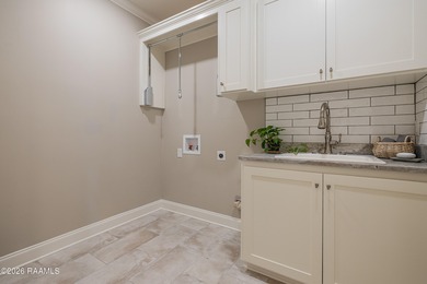 Located in the gated golf community of LeTriomphe, this on LeTriomphe Golf and Country Club in Louisiana - for sale on GolfHomes.com, golf home, golf lot