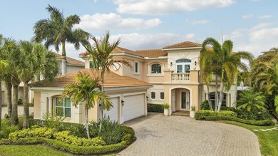 Beautiful home with a waterfront and golf course view! This home on Jupiter Country Club in Florida - for sale on GolfHomes.com, golf home, golf lot