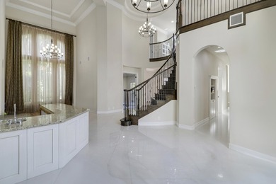 Beautiful home with a waterfront and golf course view! This home on Jupiter Country Club in Florida - for sale on GolfHomes.com, golf home, golf lot