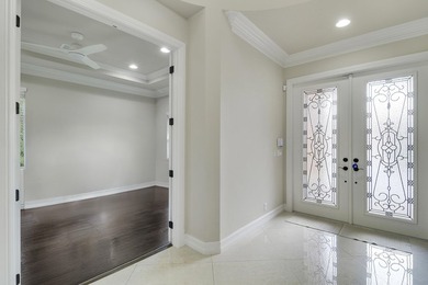 Beautiful home with a waterfront and golf course view! This home on Jupiter Country Club in Florida - for sale on GolfHomes.com, golf home, golf lot