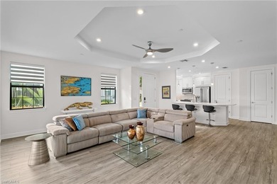 STUNNING 2-BEDROOM + DEN COACH HOME WITH BREATHTAKING WATER & on Esplanade Golf and  Country Club in Florida - for sale on GolfHomes.com, golf home, golf lot