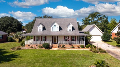 Welcome to this stunning 3-bedroom, 2.5-bathroom waterfront home on Players Course At Wyboo Plantation in South Carolina - for sale on GolfHomes.com, golf home, golf lot