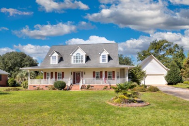 Welcome to this stunning 3-bedroom, 2.5-bathroom waterfront home on Players Course At Wyboo Plantation in South Carolina - for sale on GolfHomes.com, golf home, golf lot