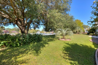 Welcome to this stunning 3-bedroom, 2.5-bathroom waterfront home on Players Course At Wyboo Plantation in South Carolina - for sale on GolfHomes.com, golf home, golf lot