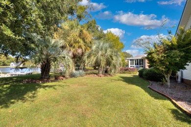 Welcome to this stunning 3-bedroom, 2.5-bathroom waterfront home on Players Course At Wyboo Plantation in South Carolina - for sale on GolfHomes.com, golf home, golf lot