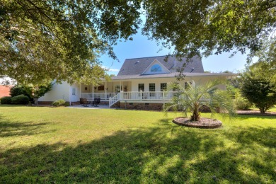 Welcome to this stunning 3-bedroom, 2.5-bathroom waterfront home on Players Course At Wyboo Plantation in South Carolina - for sale on GolfHomes.com, golf home, golf lot