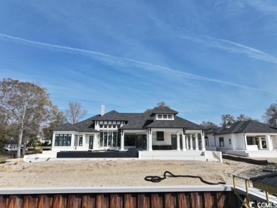 Amazing single story plan being built directly on the waterway on Barefoot Resort and Golf Club - Fazio Course in South Carolina - for sale on GolfHomes.com, golf home, golf lot