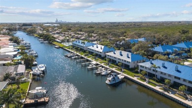 LUXURY WATERFRONT LIVING ON A WIDE, DEEP, SAILBOAT CANAL LEADING on Mangrove Bay Golf Course in Florida - for sale on GolfHomes.com, golf home, golf lot