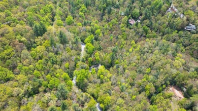 Nestled in the tranquil setting of Holly Forest IV, this on Sapphire National Golf Club in North Carolina - for sale on GolfHomes.com, golf home, golf lot