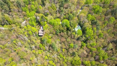 Nestled in the tranquil setting of Holly Forest IV, this on Sapphire National Golf Club in North Carolina - for sale on GolfHomes.com, golf home, golf lot
