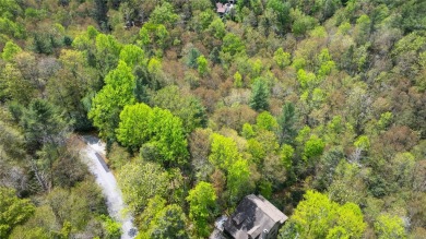 Nestled in the tranquil setting of Holly Forest IV, this on Sapphire National Golf Club in North Carolina - for sale on GolfHomes.com, golf home, golf lot