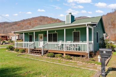 Soak up the mountains in this move-in ready home. With easy on Maggie Valley Resort and Country Club in North Carolina - for sale on GolfHomes.com, golf home, golf lot