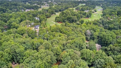 Decompress as this home is nestled on a quiet Cul-de-sac, across on Sedgefield Golf Course in North Carolina - for sale on GolfHomes.com, golf home, golf lot