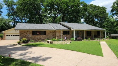 Located on the 9th Fairway and among the trees of the beautiful on Woodland Hills Golf Club in Texas - for sale on GolfHomes.com, golf home, golf lot
