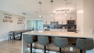 Welcome to a home that feels like it's been pulled straight from on Jacaranda West Country Club in Florida - for sale on GolfHomes.com, golf home, golf lot