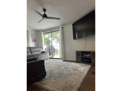 THIS TWO BEDROOM TWO BATH HOME SITS ON THE GOLF COURSE WITH A on Silver Dollar Golf and Trap Club in Florida - for sale on GolfHomes.com, golf home, golf lot