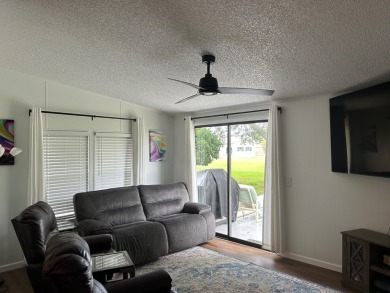 THIS TWO BEDROOM TWO BATH HOME SITS ON THE GOLF COURSE WITH A on Silver Dollar Golf and Trap Club in Florida - for sale on GolfHomes.com, golf home, golf lot