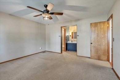 Red brick ranch style home with cedar accents located in Surrey on Golf Club At Surrey Hills in Oklahoma - for sale on GolfHomes.com, golf home, golf lot
