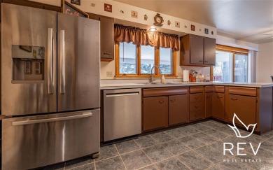Location, location, location! Great 4 bed/2 bath home on an on Olive Glenn Golf and Country Club in Wyoming - for sale on GolfHomes.com, golf home, golf lot