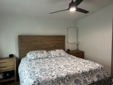 THIS TWO BEDROOM TWO BATH HOME SITS ON THE GOLF COURSE WITH A on Silver Dollar Golf and Trap Club in Florida - for sale on GolfHomes.com, golf home, golf lot