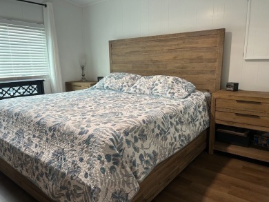 THIS TWO BEDROOM TWO BATH HOME SITS ON THE GOLF COURSE WITH A on Silver Dollar Golf and Trap Club in Florida - for sale on GolfHomes.com, golf home, golf lot