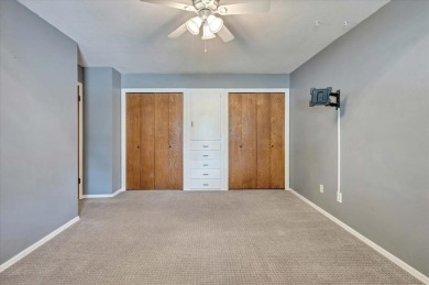 Red brick ranch style home with cedar accents located in Surrey on Golf Club At Surrey Hills in Oklahoma - for sale on GolfHomes.com, golf home, golf lot