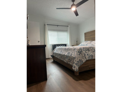 THIS TWO BEDROOM TWO BATH HOME SITS ON THE GOLF COURSE WITH A on Silver Dollar Golf and Trap Club in Florida - for sale on GolfHomes.com, golf home, golf lot