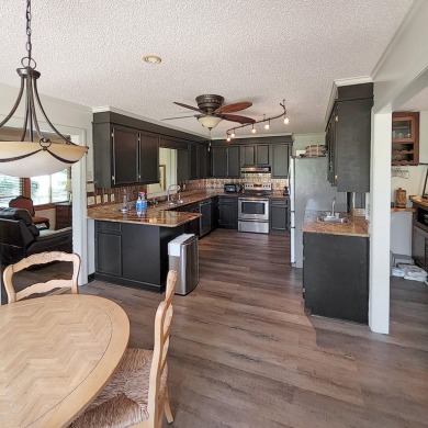 Live the lake and golf life at 119 Saluda Drive, located in the on Santee-Cooper Country Club in South Carolina - for sale on GolfHomes.com, golf home, golf lot
