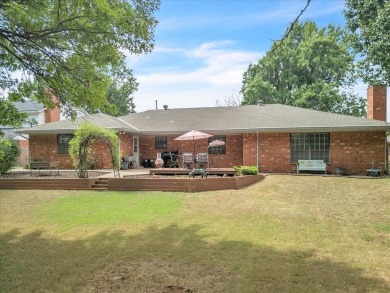 Red brick ranch style home with cedar accents located in Surrey on Golf Club At Surrey Hills in Oklahoma - for sale on GolfHomes.com, golf home, golf lot