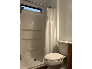 THIS TWO BEDROOM TWO BATH HOME SITS ON THE GOLF COURSE WITH A on Silver Dollar Golf and Trap Club in Florida - for sale on GolfHomes.com, golf home, golf lot