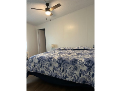 THIS TWO BEDROOM TWO BATH HOME SITS ON THE GOLF COURSE WITH A on Silver Dollar Golf and Trap Club in Florida - for sale on GolfHomes.com, golf home, golf lot