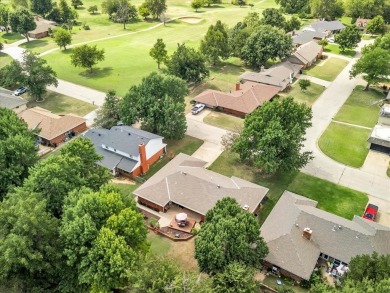 Red brick ranch style home with cedar accents located in Surrey on Golf Club At Surrey Hills in Oklahoma - for sale on GolfHomes.com, golf home, golf lot