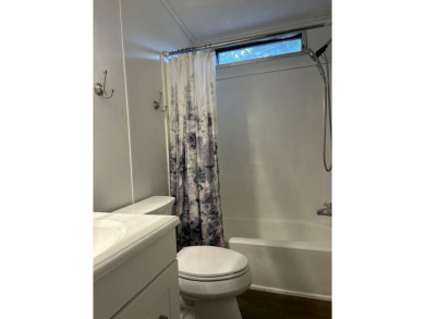 THIS TWO BEDROOM TWO BATH HOME SITS ON THE GOLF COURSE WITH A on Silver Dollar Golf and Trap Club in Florida - for sale on GolfHomes.com, golf home, golf lot