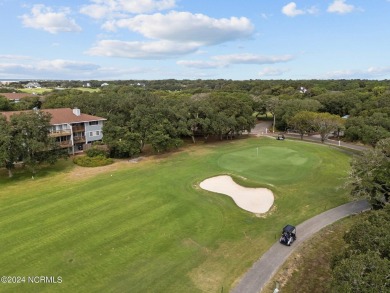 Wonderful end unit in Caswell Dunes overlooking the golf course on Oak Island Golf Club in North Carolina - for sale on GolfHomes.com, golf home, golf lot