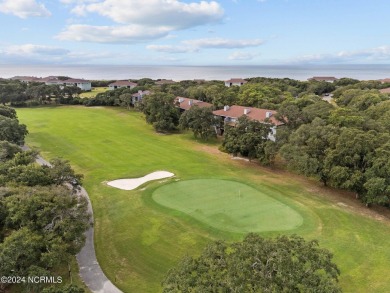 Wonderful end unit in Caswell Dunes overlooking the golf course on Oak Island Golf Club in North Carolina - for sale on GolfHomes.com, golf home, golf lot