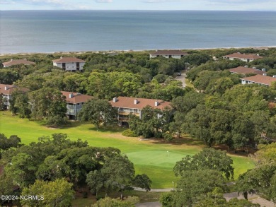 Wonderful end unit in Caswell Dunes overlooking the golf course on Oak Island Golf Club in North Carolina - for sale on GolfHomes.com, golf home, golf lot