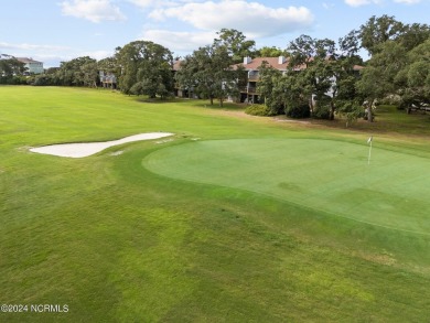 Wonderful end unit in Caswell Dunes overlooking the golf course on Oak Island Golf Club in North Carolina - for sale on GolfHomes.com, golf home, golf lot