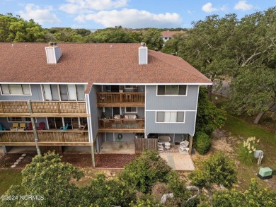 Wonderful end unit in Caswell Dunes overlooking the golf course on Oak Island Golf Club in North Carolina - for sale on GolfHomes.com, golf home, golf lot