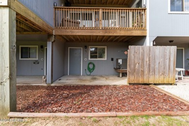 Wonderful end unit in Caswell Dunes overlooking the golf course on Oak Island Golf Club in North Carolina - for sale on GolfHomes.com, golf home, golf lot