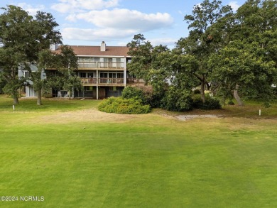 Wonderful end unit in Caswell Dunes overlooking the golf course on Oak Island Golf Club in North Carolina - for sale on GolfHomes.com, golf home, golf lot