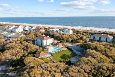 Wonderful end unit in Caswell Dunes overlooking the golf course on Oak Island Golf Club in North Carolina - for sale on GolfHomes.com, golf home, golf lot