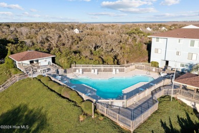 Wonderful end unit in Caswell Dunes overlooking the golf course on Oak Island Golf Club in North Carolina - for sale on GolfHomes.com, golf home, golf lot