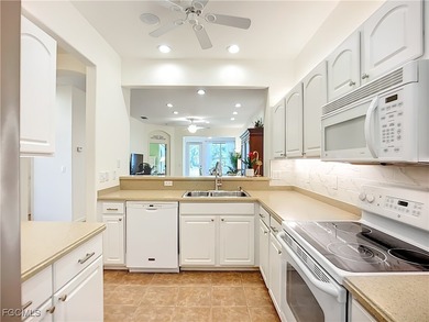 *Honey, we're home!* You're going to love this stunning attached on Herons Glen Golf and Country Club in Florida - for sale on GolfHomes.com, golf home, golf lot