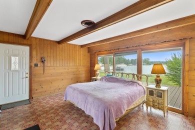Rare opportunity on all-sports Goguac Lake! This 3-bedroom, 2 on Battle Creek Country Club in Michigan - for sale on GolfHomes.com, golf home, golf lot