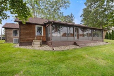 Rare opportunity on all-sports Goguac Lake! This 3-bedroom, 2 on Battle Creek Country Club in Michigan - for sale on GolfHomes.com, golf home, golf lot
